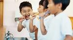 Children brushing their teeth